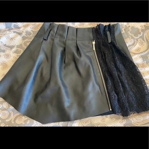 Asymmetrical black faux leather skort